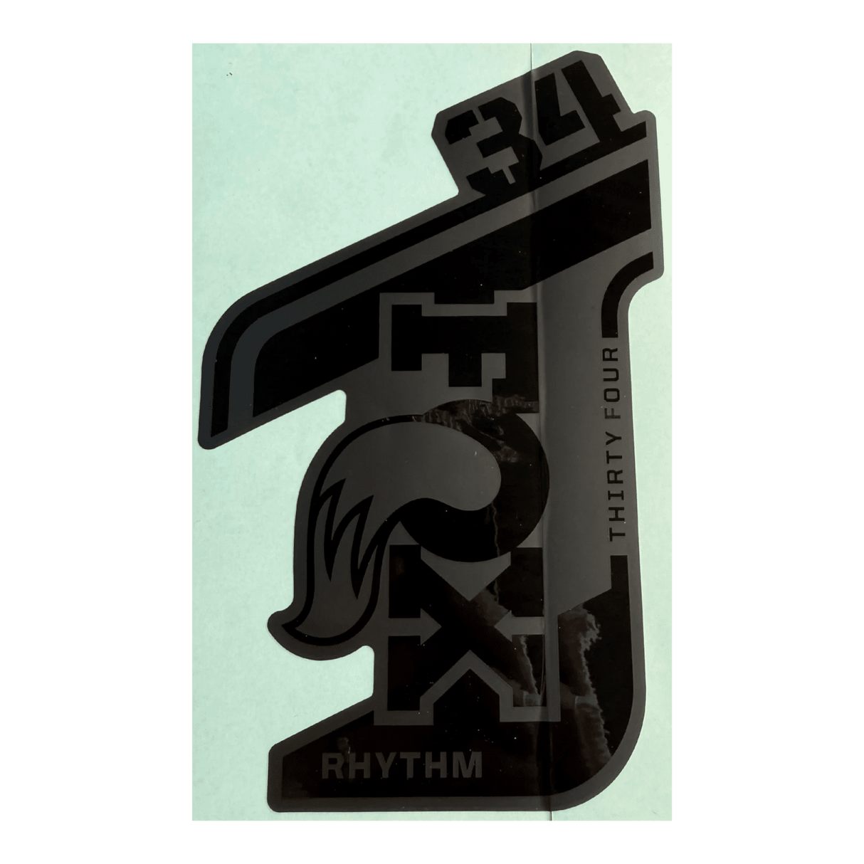 024-11-550_2021 FOX 34 Rhythm Decal | Gloss Stealth | Matte Black Background